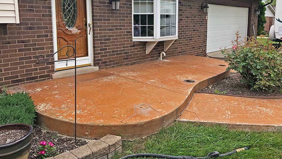 stamped concrete front patio before concrete sealer stripping in macomb and oakland county, MI