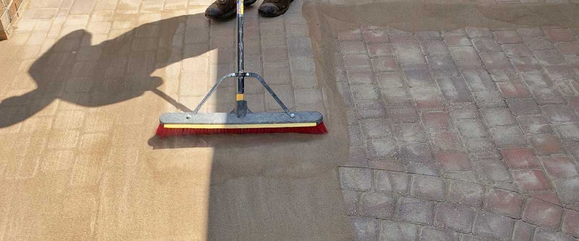 poly sanding brick paver court yard