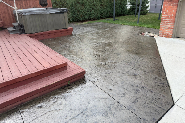 stamped concrete patio with dark grey antique highlights added